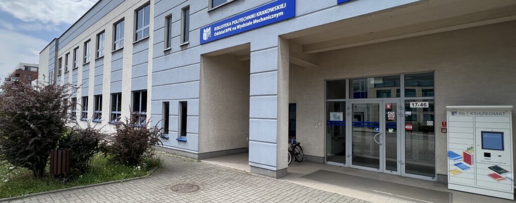 Fasada budynku biblioteki na Wydziale Mechanicznym. Na zdjęciu widoczny także książkomat